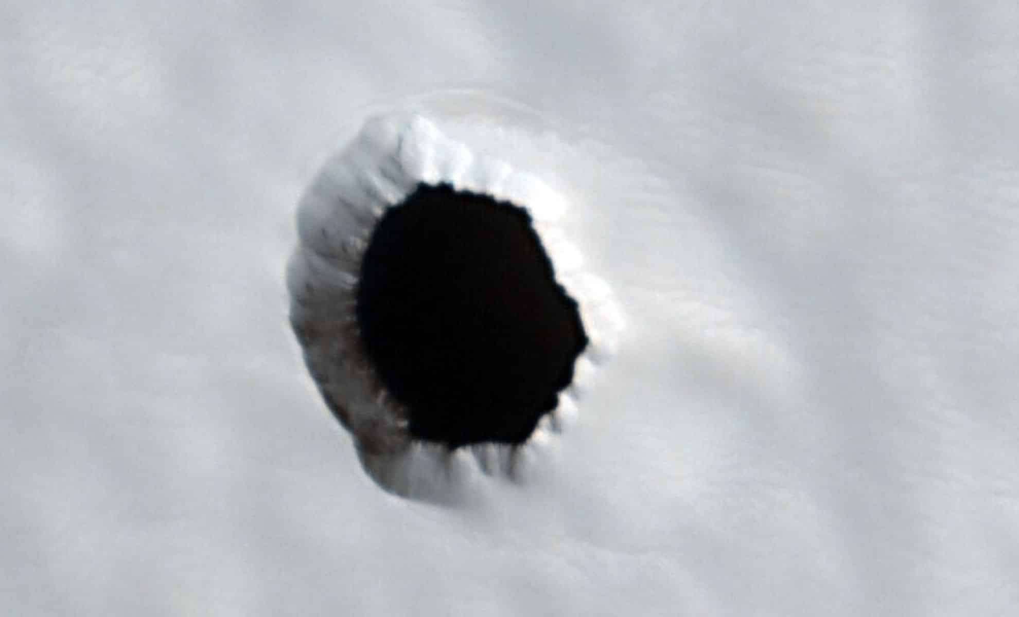 Mars' Enigmatic Pit Captivates Researchers and Fuels Exploration Prospects 
