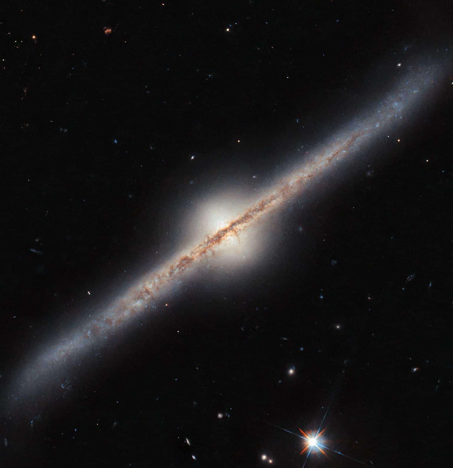 This-NASAESA-Hubble-Space-Telescope-image-features-spiral-galaxy-UGC-10043-12c1b7b61488019c5923acaf782cfa98.jpg