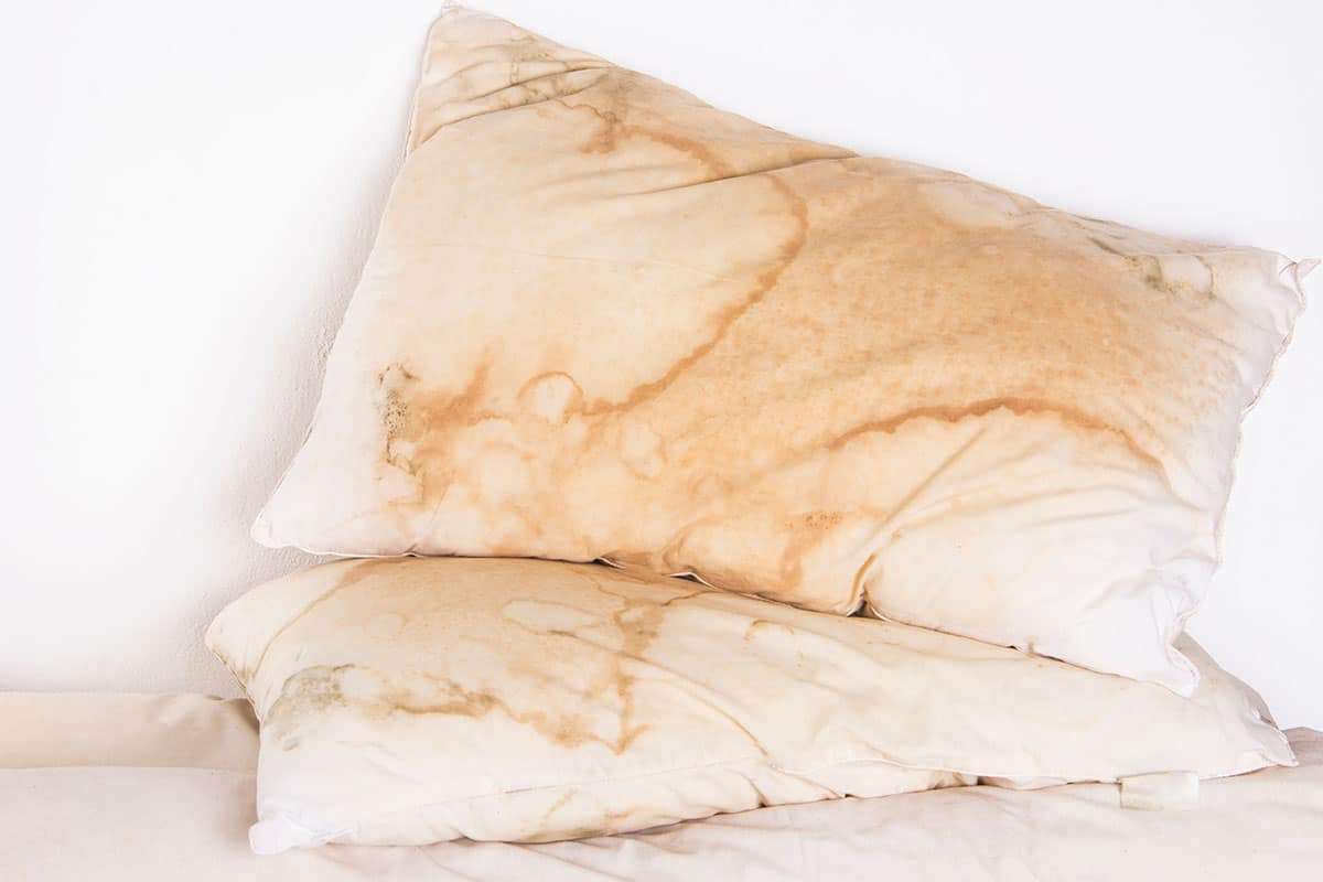 What Yellow Pillow Stains Reveal About Your Sleep Environment 
