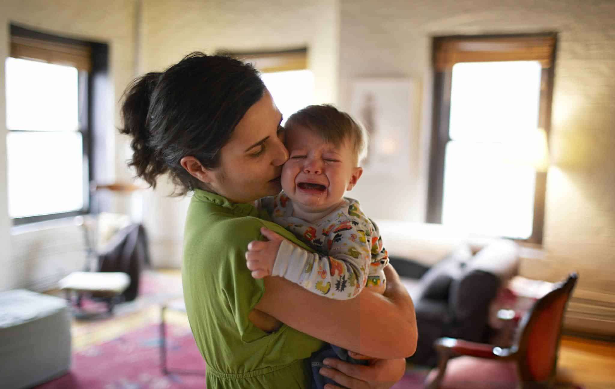Mother-holding-and-kissing-crying-baby-boy-7b63aba21e83b5e3513f031b33b3150a.jpg