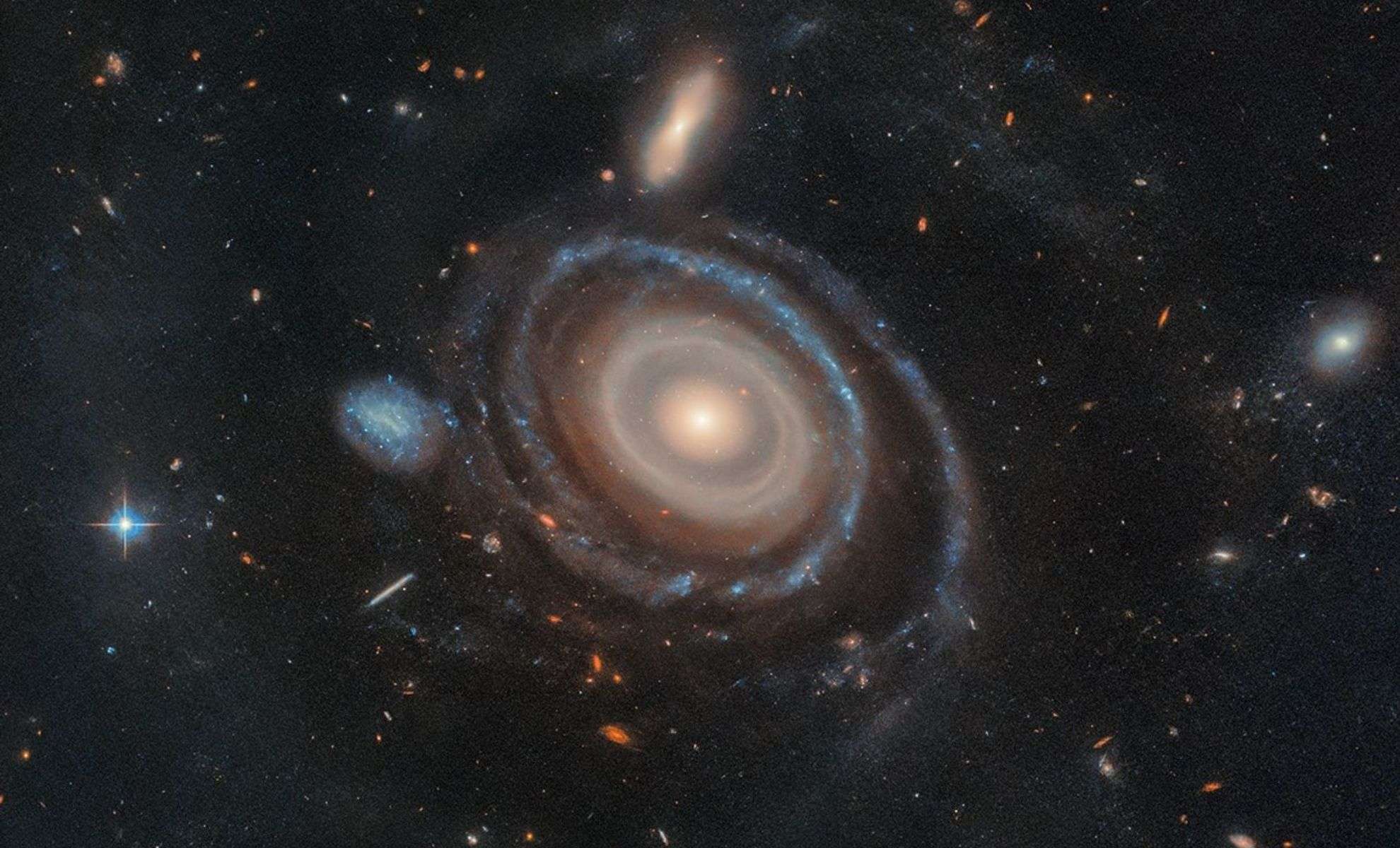 Hubble Captures Rare Galaxy with Nine Expanding Stellar Rings 