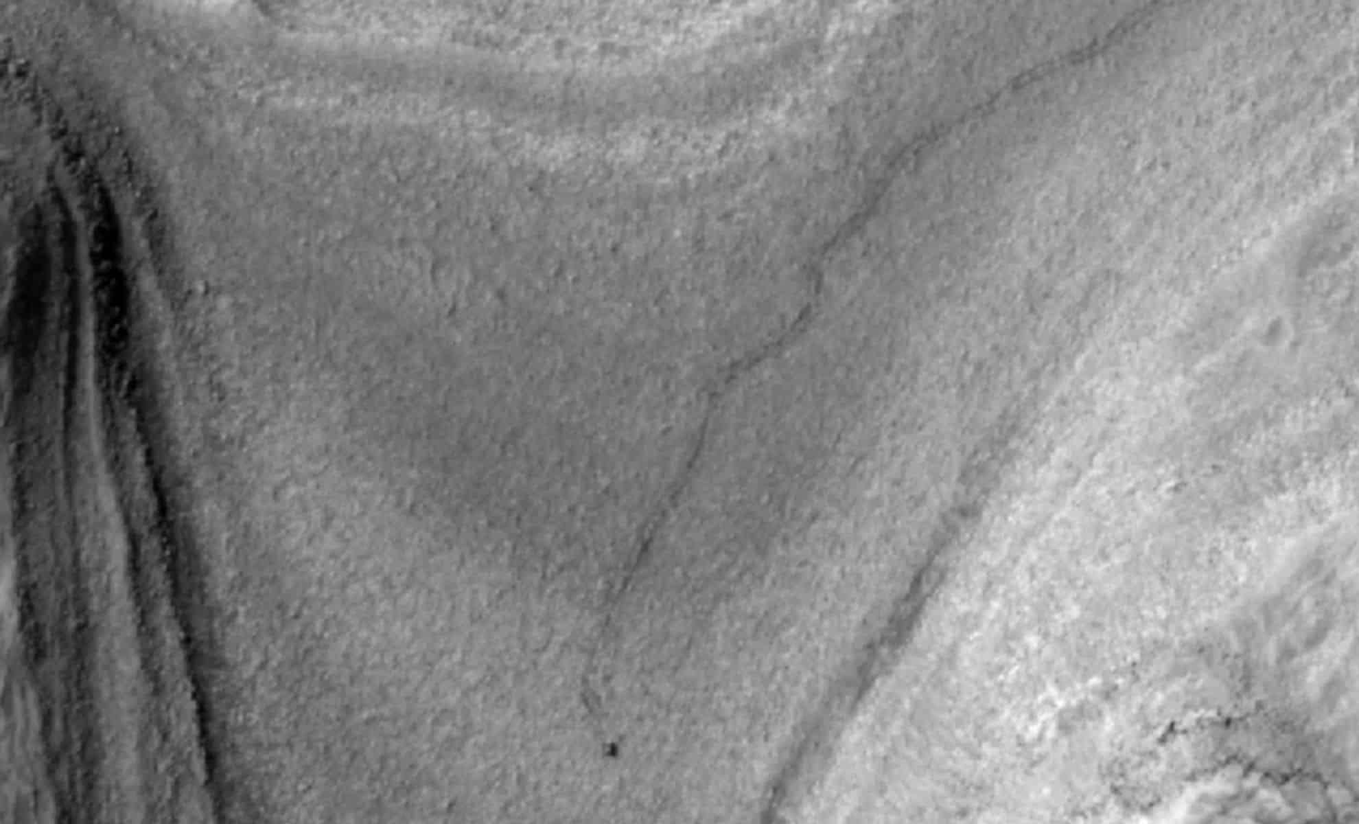 NASA Orbiter Captures Distinct Rover Tracks on Martian Surface 