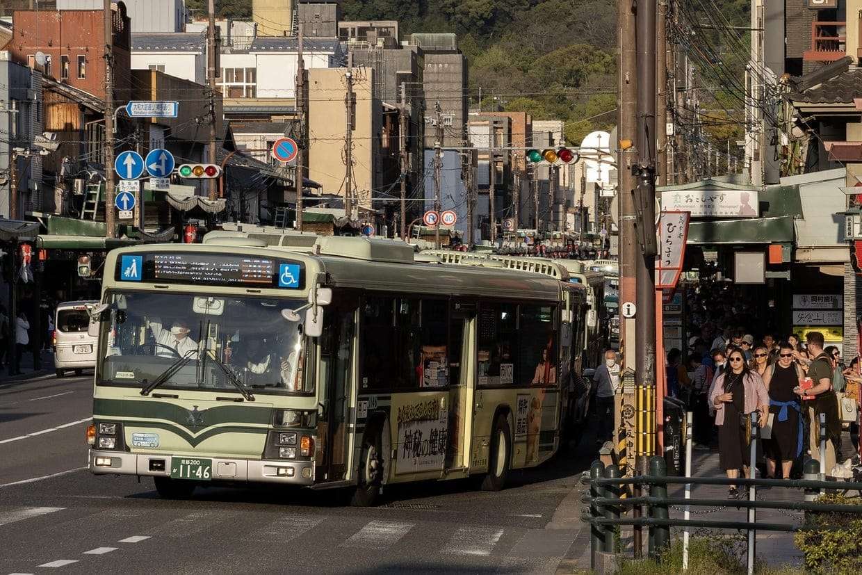 a-city-bus-drives-along-a-street-in-kyoto-japan-on-saturday-april-13-2024-fbc9f8365664a3b30be57ef654c4b1bd.jpeg