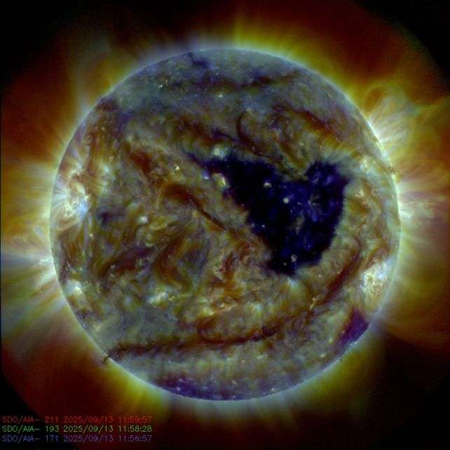 The-sun-captured-in-three-extreme-ultraviolet-wavelengths-showing-the-enormous-coronal-hole-435b93196ba386af049e35421cd2344d.jpg