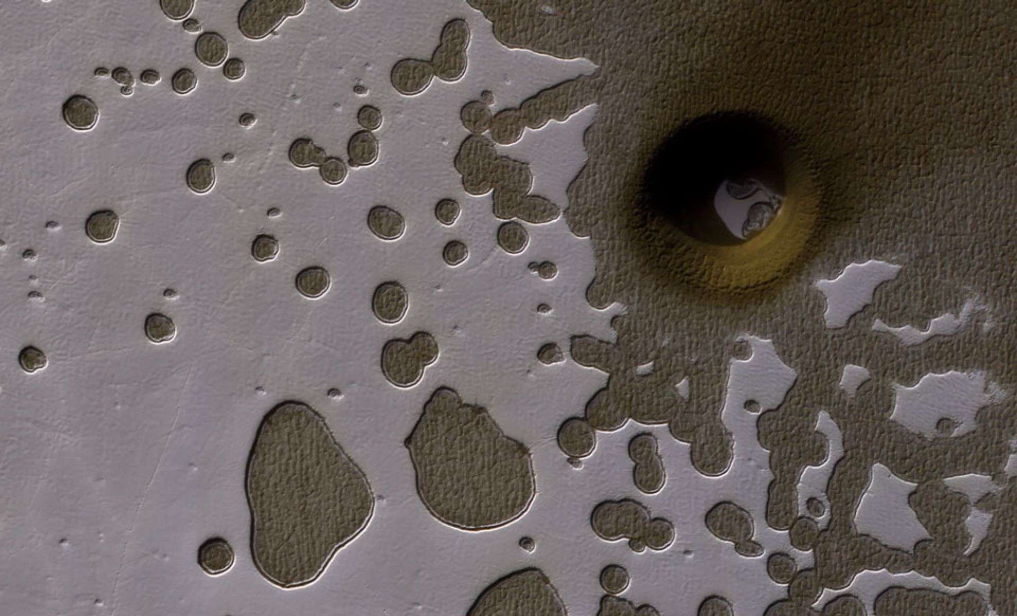 Massive 100-Meter-Wide Pit on Mars Spurs New Theories About Hidden Life 