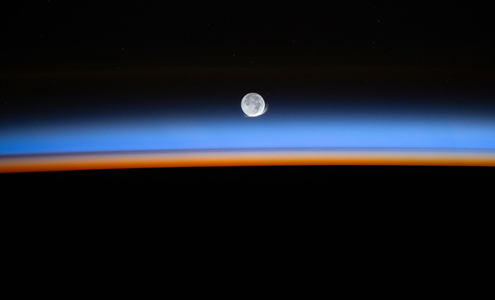 Astronaut Captures Rare Lunar Halo Illuminating Moon From Space 
