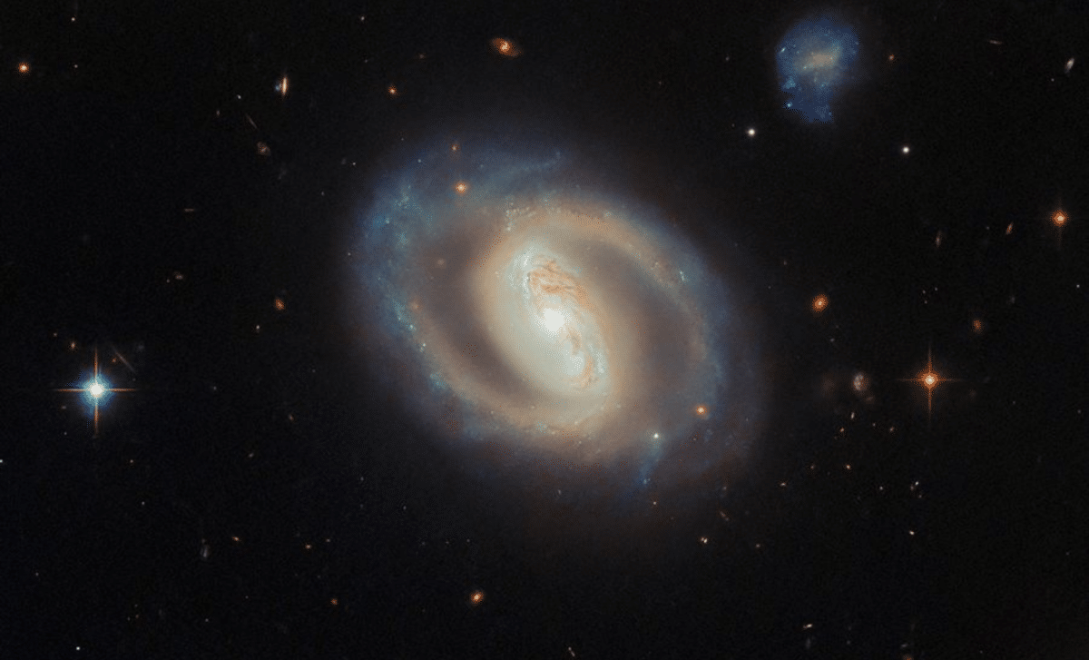 Hubble Reveals Energetic Spiral Galaxy Hosting a Colossal Black Hole 
