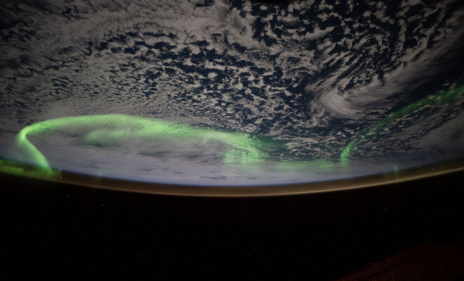 ESA Astronaut Documents Vivid Neon Aurora from Space in Rare Orbital View 