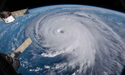 Rapid Intensification of Coastal Tropical Cyclones Tied to Climate Change