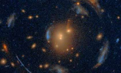Record-Breaking Einstein Cross Discovered Within a Rare Galactic Carousel Reveals Dark Matter Insights