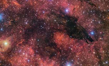 Scientists Reveal a Mysterious Black ‘Wolf’ Nebula in Deep Space