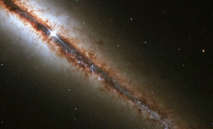 Hubble Reveals Unusual Warped Disk in Spiral Galaxy UGC 10043