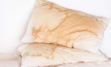 What Yellow Pillow Stains Reveal About Your Sleep Environment