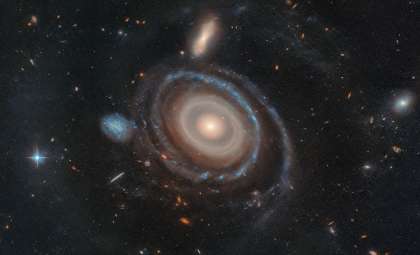 Hubble Captures Rare Galaxy with Nine Expanding Stellar Rings