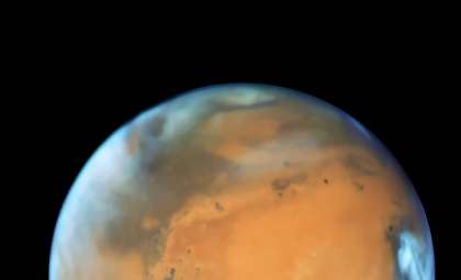 Titan’s Mysterious Atmosphere Reveals Earth-Like Cloud Activity