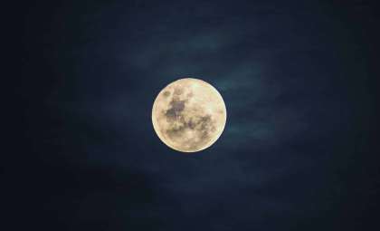 Discover Why Tonight’s Full Moon Appears Larger and Radiates a Fiery Glow