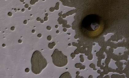 Massive 100-Meter-Wide Pit on Mars Spurs New Theories About Hidden Life