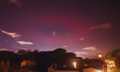 Photographer Captures Rare Scarlet Halo Over Italian Alps
