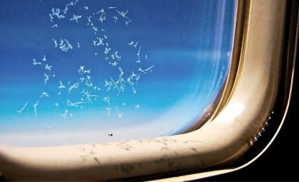 Why Airplane Windows Have That Tiny Hole—and What It Does