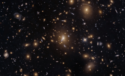 Hubble Reveals a Galaxy Cluster Warping Light Across the Cosmos